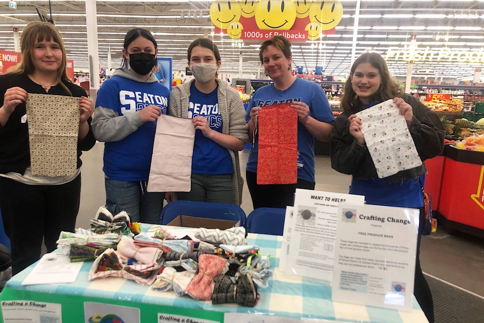 Seaton students handed out produce bags made of upcycled, donated fabric at Walmart in Vernon Friday, April 22, 2022. (Brendan Shykora - Morning Star)
