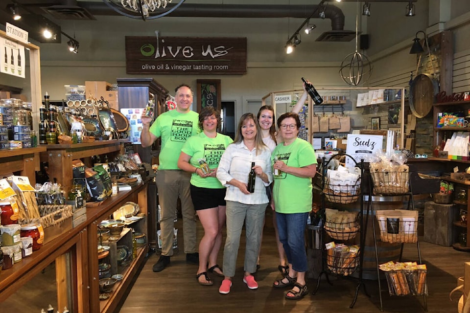 Vernon’s Olive Us Oil and Vinegar Tasting Room coming on board as a sponsor of the North Okanagan Good Food Box program is celebrated by program members Patrick Vance (from left), Jayme McKillop, Olive Us owner Janet Cody, university food student Bailey Morin and program member Donna Antonishak. (Contributed)