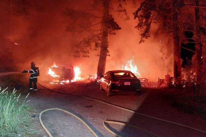 North Westside Fire Rescue crews extinguish an early morning blaze at the Evely Recreation Site on Wednesday, July 6. Two park officers lost their trailer and vehicle, three pets and their belongings in the blaze. (North Westside Fire Rescue photo)