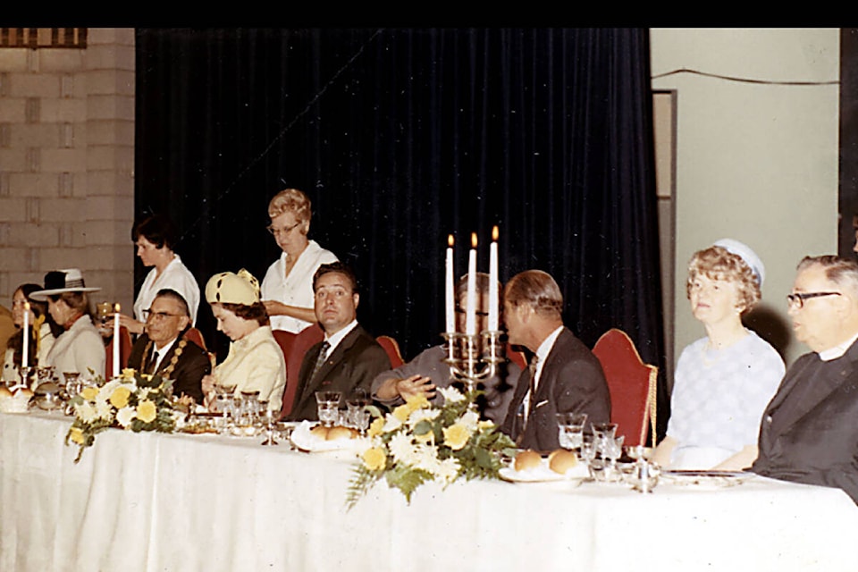 Her Majesty Queen Elizabeth II (seated, fourth from left) has dinner at the Vernon Recreation Centre during a visit in 1971. (Greater Vernon Museum & Archives Photograph Collection)