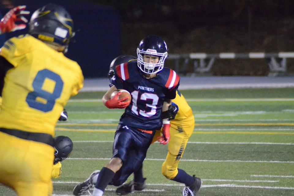 Vernon Panthers receiver Tristan Mckenzie (13) shakes off a tackle from a Nechako Valley Vikings (Vanderhoof) defender during the Cats’ 44-8 AA Senior Varsity exhibition football win Friday, Sept. 30, at Greater Vernon Athletic Park. (Darren Hove Photo)_