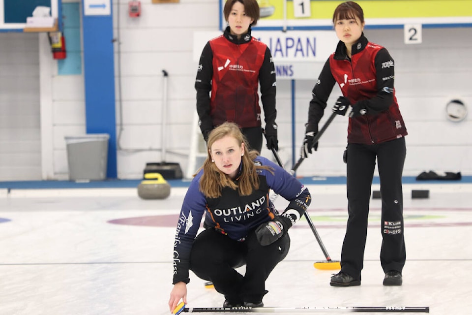 Corryn Brown of Kamloops (front) watches her shot, as do opponents Hasumi Ishigooka (left) and Midori Suzuki from Nagano,Japan,during the women’s final Sunday, Oct. 2, of the Prestige Hotels and Resorts Curling Classic at the Vernon Curling Club. (Roger Knox - Morning Star)