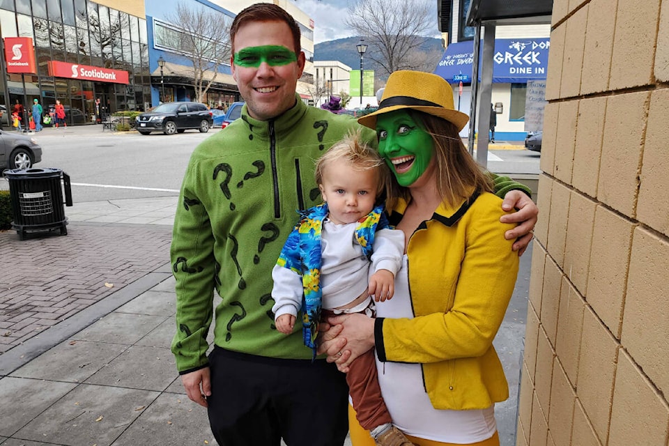 The Hutchinsons portrayed three roles of actor Jim Carrey as they walked along the Downtown Vernon Association’s Halloween Treat Trail. (Roger Knox - Morning Star)