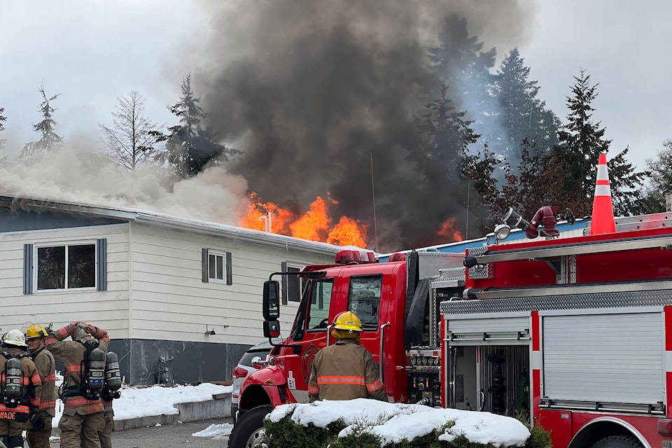 Firefighters are called to a blaze in a trailer park in Coldstream Friday morning. (Brendan Shykora - Morning Star)