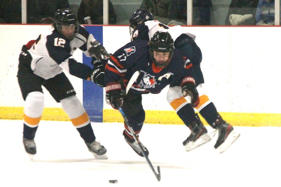 Kamloops Blazers defenceman Dayton Koldyk (17) tries to split Vernon Vipers defenders Kalin Frick (12) and Jack Johnson (14) during the Vipers’ Tier 2 U15 minor hockey tournament Sunday, Dec. 4, at the Priest Valley Arena. (Roger Knox - Morning Star)