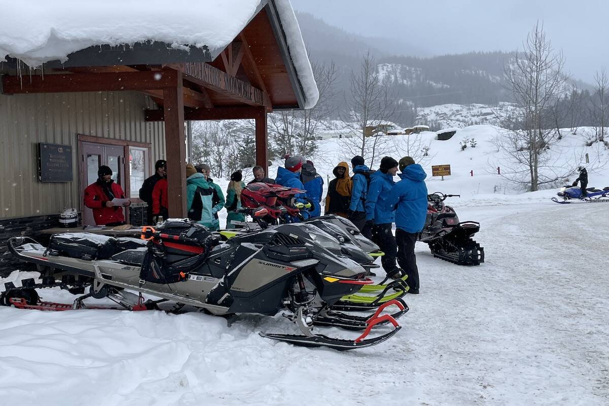 A group signs waivers in preparation for the start of the charity ride. (Zachary Delaney/Revelstoke Review)