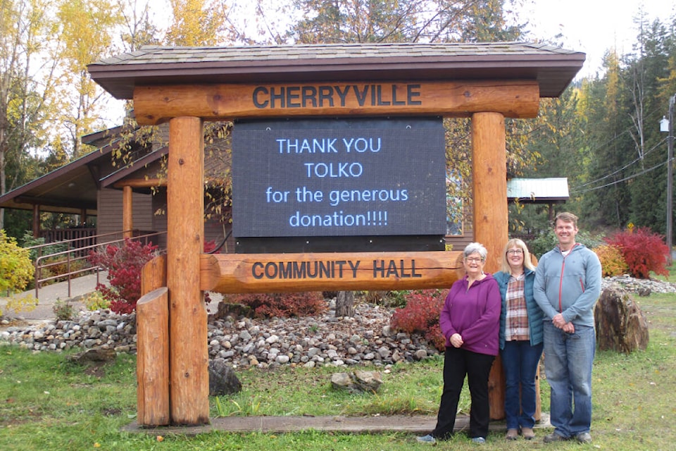 Lynne Frerichs of the Cherryville Community Club (from left) is joined by Cherryville Food and Resource Society president Sharon Harvey, and Ray Friesen of Tolko, at the new club digital sign. Tolko donated $10,000 toward the sign. (Contributed)