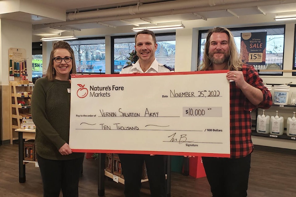 Nature’s Fare Markets’ Tara Berger (left) and Brandon Molzahn (right), present a cheque to Neil S. Thompson (middle) of the Salvation Army Food Bank in Vernon. (Contributed)