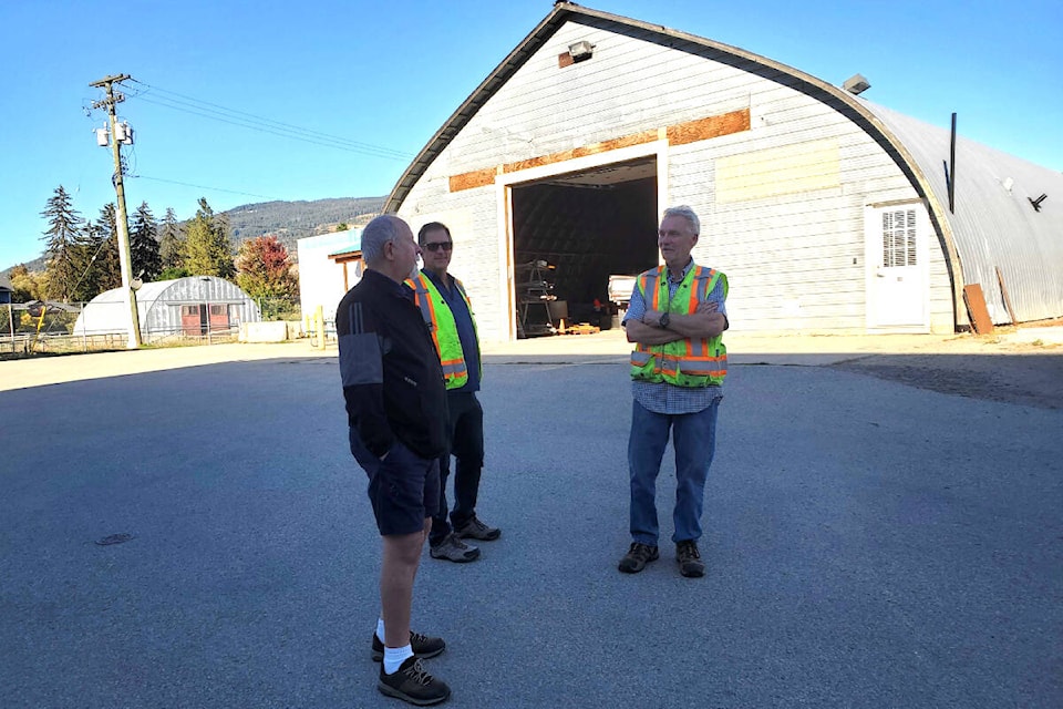 Coldstream resident Jack Borden (left) discusses the potential for a new public works building, in front of the existing building with district operations superintendent of utilities Keith Whiteley (centre) and district operations superintendent of public works and parks Mike Pethick. (Roger Knox - Morning Star)