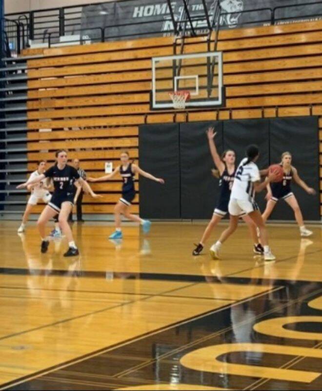 In black: Panthers Isla Jolly (on ball) defends while Paige Lahey (left) and Kennedy West help out against Seaquam Secondary over the weekend. (Contributed)