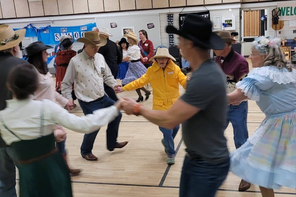 Helen Sidney, the 100-year-old Citizen of the Year, (yellow jacket) is seen dancing at the Vernon Star Country Square Dance open house last week. (Contributed)