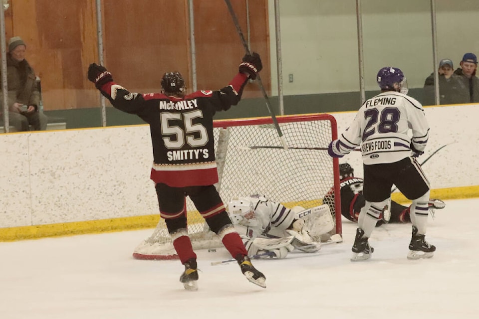 Ethan McKinley celebrates a goal by Coletyn Boyarski against North Okanagan goalie Austin Seibel and defender Colton Fleming during the Osoyoos Coyotes’ 7-6 overtime win in Game 4 of their KIJHL divisional semifinal Wednesday, Feb. 22, at Armstrong’s Nor-Val Sports Centre. (Roger Knox - Black Press)