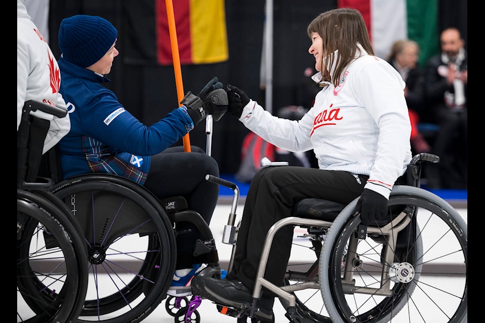 Ina Forrest fist pumps a competitor at the World Wheelchair Curling Championship 2023, Richmond, Canada. (WCF/Cheyenne Boone)
