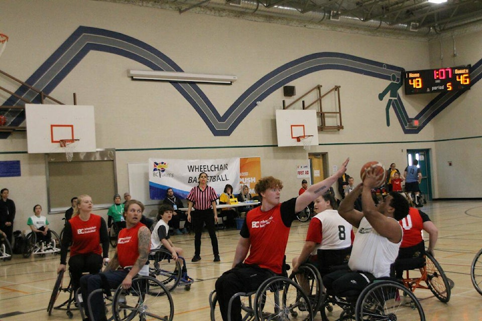 Vancouver-Coastal and Thompson-Okanagan players compete during the wheelchair basketball bronze medal match from Lavington Elementary School at the Greater Vernon 2022 B.C. Winter Games on Sunday, March 26 (Bowen Assman- Black Press Photo).