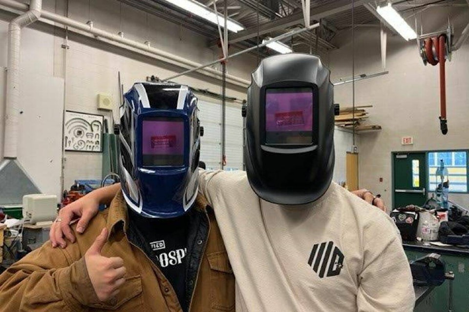 Charles Bloom students with their new welding helmets, courtesy of the North Okanagan Vintage Car Club. (Bowen Assman/Morning Star)