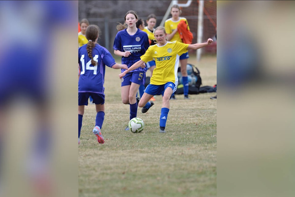 Ashlynn Funston (with ball) passes to a Vernon Tolko United U14 girls teammate during the season-opening rep soccer Icebreaker Tournament in Lake Country. (Graham Genge Photo)