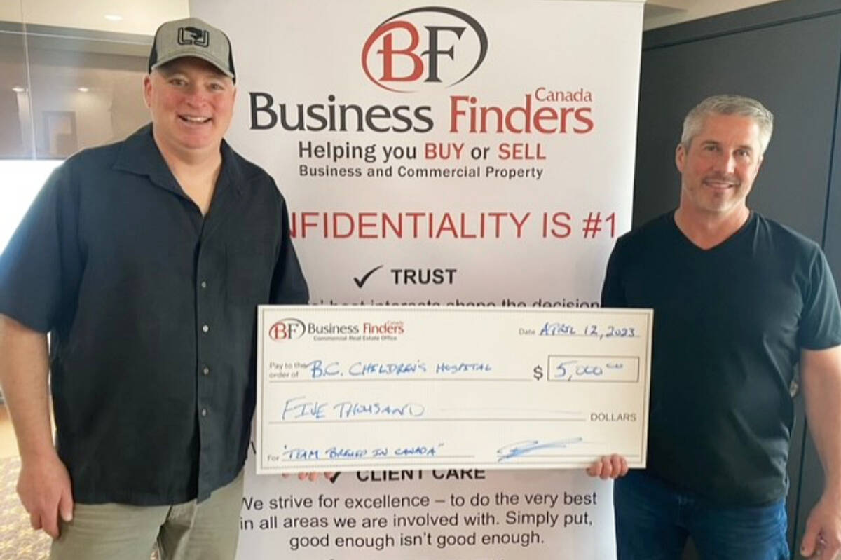 Team Brewed in Canada Fishing Derby co-organizer Mike Bridge, left, receives a $5,000 cheque for BC Childrens Hospital from Brent Marshall of Brent Marshall Commercial Group. He is sponsoring the 1st place prize for both lakes, along with Fair Realty Shuswap. (Photo contributed)