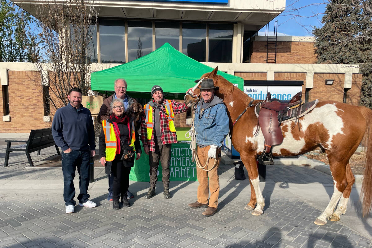 Julius Bloomfield, right, and his horse River. Councillors James Miller, back left, and Campbell Watt, left, marked the start of the 33rd season of the Penticton Farmers Market on Saturday, April 15. (Photo- City of Penticton/Facebook)