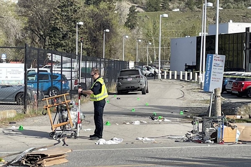 An RCMP traffic analyst officer is seen conducting an investigation after an early morning crash (Apr. 27) on Enterprise Way between Leckie and Banks roads. (Gary Barnes/Capital News)