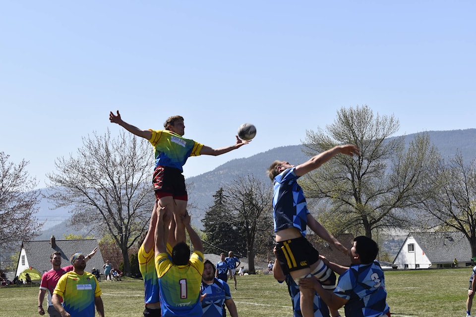 The Penticton Harlequins, blue, and Vernon Jackals, yellow, played to a 15-15 draw on Saturday, April 29, at McNicol Park in Penticton to open the new spring season. (Logan Lockhart- Western News)