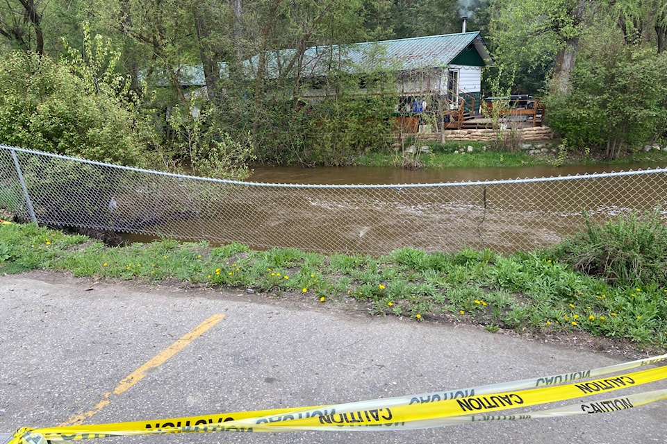 Bessette Creek has caused erosion behind the Twin Creeks Motel parking lot. (Jennifer Smith - Morning Star)