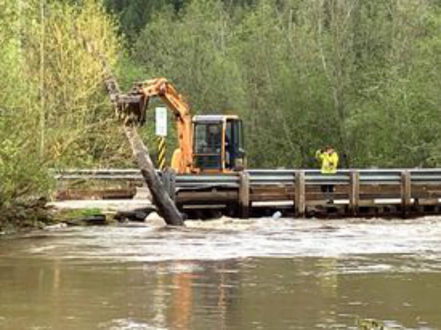 AIM Roads clears the path below Haines Road bridge in Silver Creek on the weekend of May 6 to try to stop flooding. (Photo contributed)