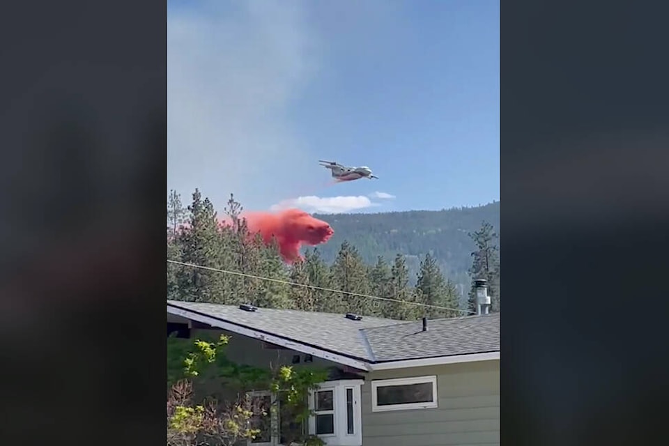 BC Wildfire plane drops retardant on a fire in Kalamalka Lake Provincial Park Friday, May 12. (Debbie Moore video still)