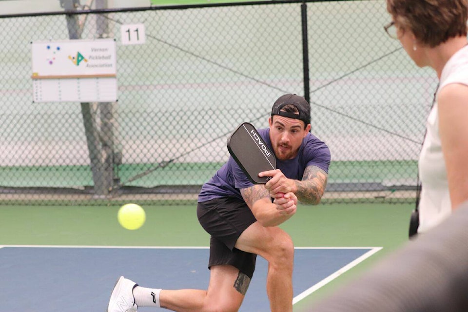 Kamloops’ Brett Forsythe makes a backhand shot during the men’s doubles 5.0 all ages final on Sunday, May 14 from Vernon. (Bowen Assman-Morning Star Photo)