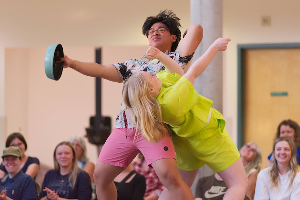 First on the runway, students Sergs Oriana and Violet Vetter model clothes from Man+Woman Home in animated fashion at the Famine For Fashion fundraiser at the Salmon Arm Secondary Sullivan campus Tuesday evening, May 16, 2023. (Lachlan Labere-Salmon Arm Observer)