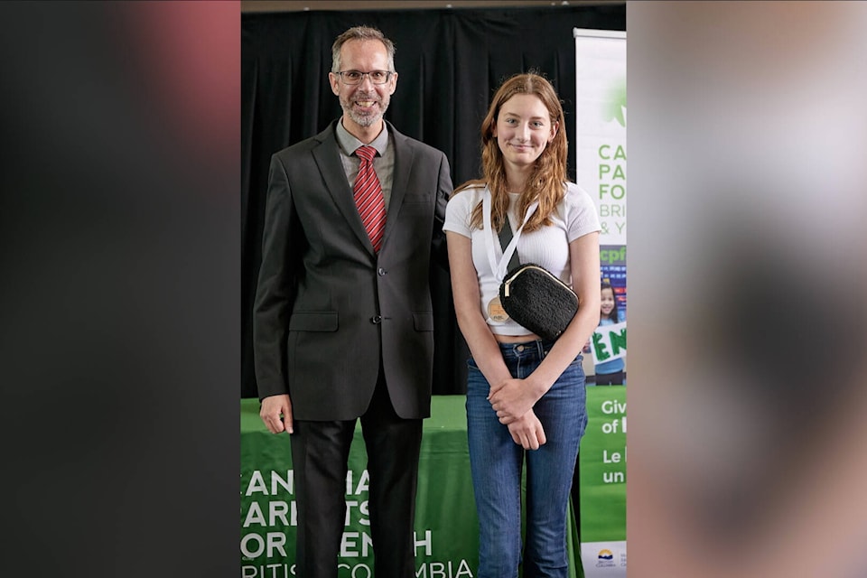 Hannah Gordon, Grade 7 late French Immersion student at Harwood Elementary, with CPF BC & Yukon Executive Director Jason Howe. Gordon took home a bronze medal at the 2023 Canadian Parents for French B.C. and Yukon Provincial Concours D’art Oratoire. (Submitted photo)