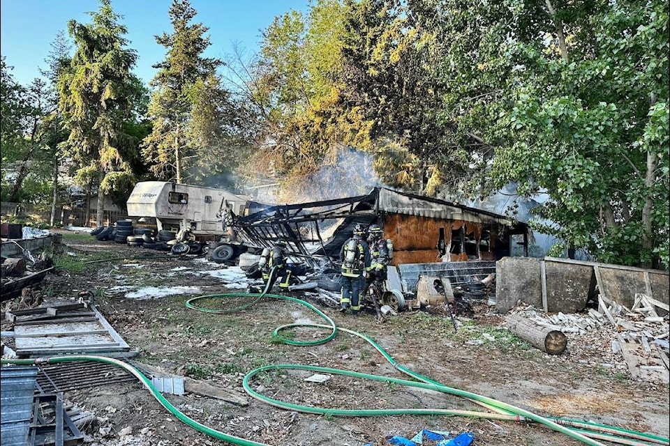 A hedge fire destroyed a shed and a RV trailer on Friday morning, June 2. (West Kelowna Fire Department)