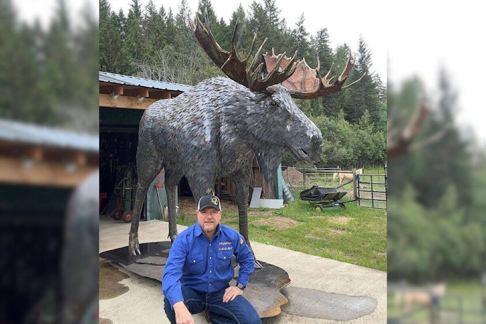 Spallumcheen’s Braden Kiefiuk of Majestic Metal Art with his latest creation, an eight-foot tall moose weighing close to 1,000-pounds and featuring nearly 5,000 pieces of metal. (Courtesy Braden Kiefiuk)
