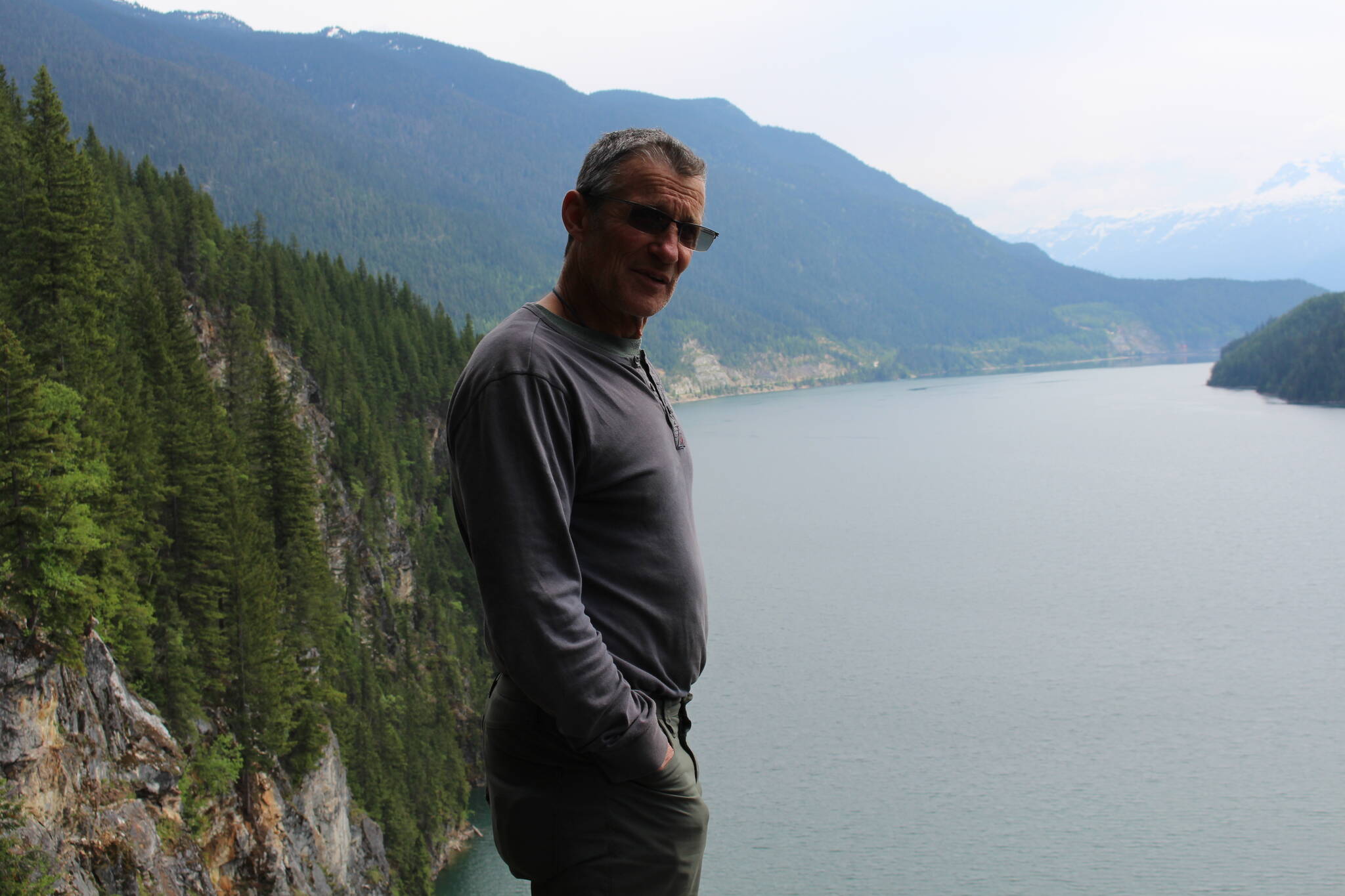 Eric Dafoe looks out over Lake Revelstoke from the top of Waterworld. (Zachary Delaney/Revelstoke Review)