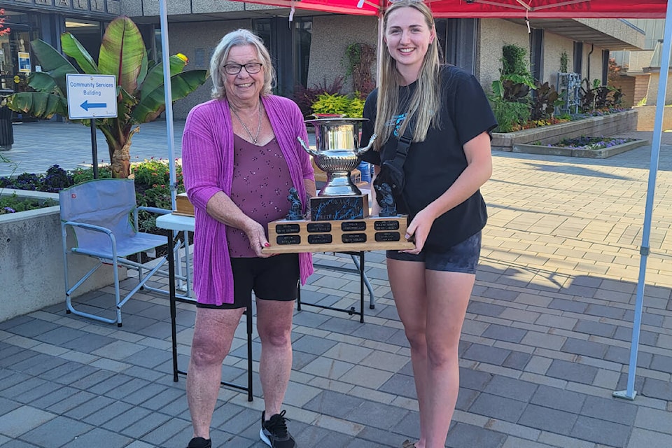 Aimee Skinner (right) is presented the 2023 North Okanagan Tim Hortons Athlete of the Year award from committee member Ann Holmes during the annual awards ceremony Thursday, June 22, in Vernon. Skinner helped a pair of teams in different sports win provincial championships. She shares the honour with cycling Leah Goldstein, who was not on hand to accept the first tie for Athlete of the Year in the awards’ 30-year history. (Roger Knox - Morning Star)