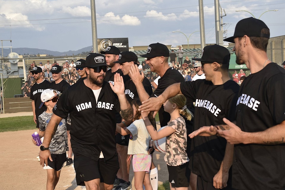 Team Gorges, named after former Montreal Canadiens defenceman Josh Gorges, takes the field on Friday, June 23, in Kelowna for the annual Homebase Charity Slo-Pitch tournament. (Logan Lockhart/Black Press)