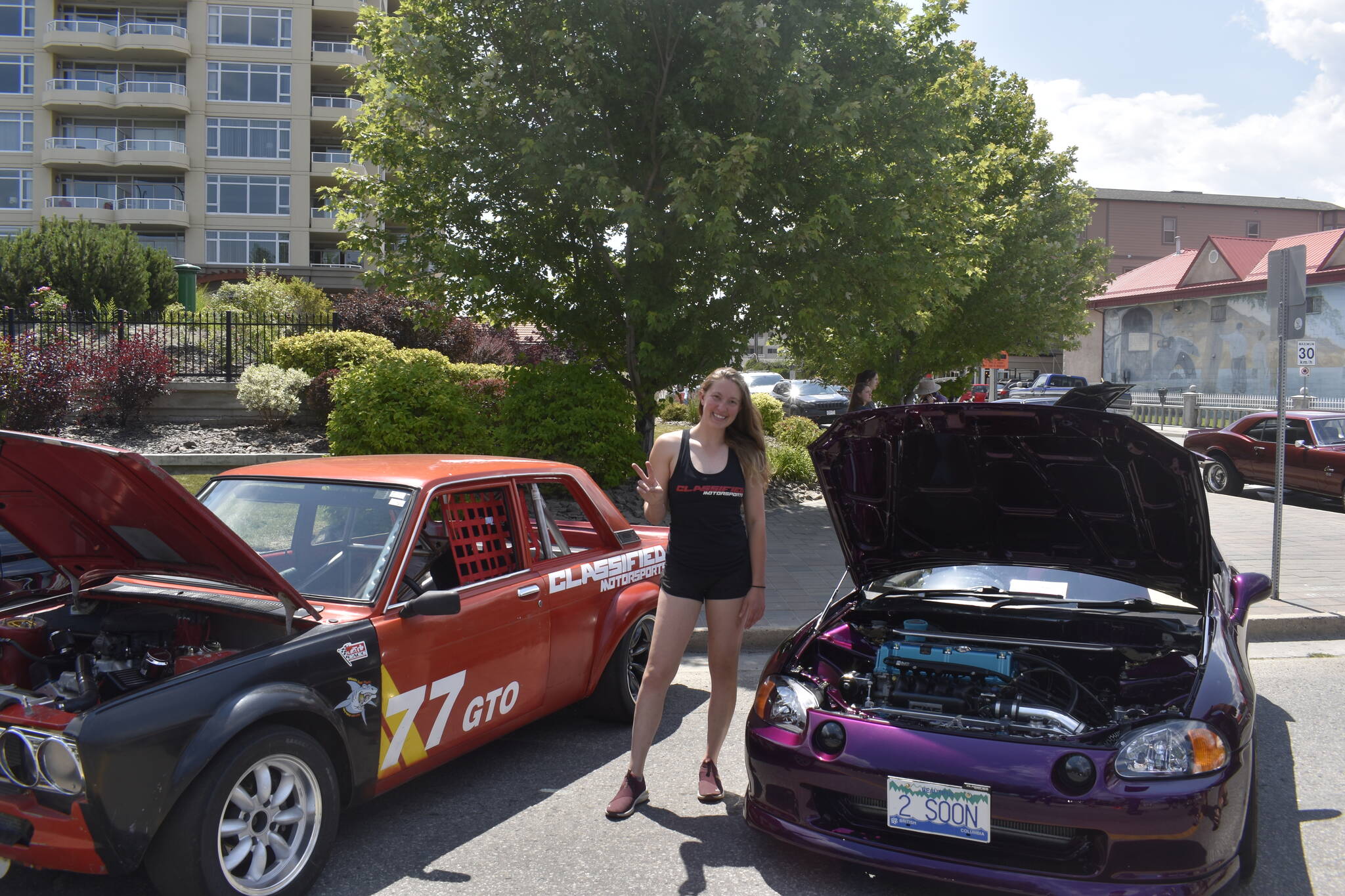 Justine Boyer with her car on the right, as well as her fathers on the left, representing Classified Motorsports in Kelowna. (Logan Lockhart/Black Press)