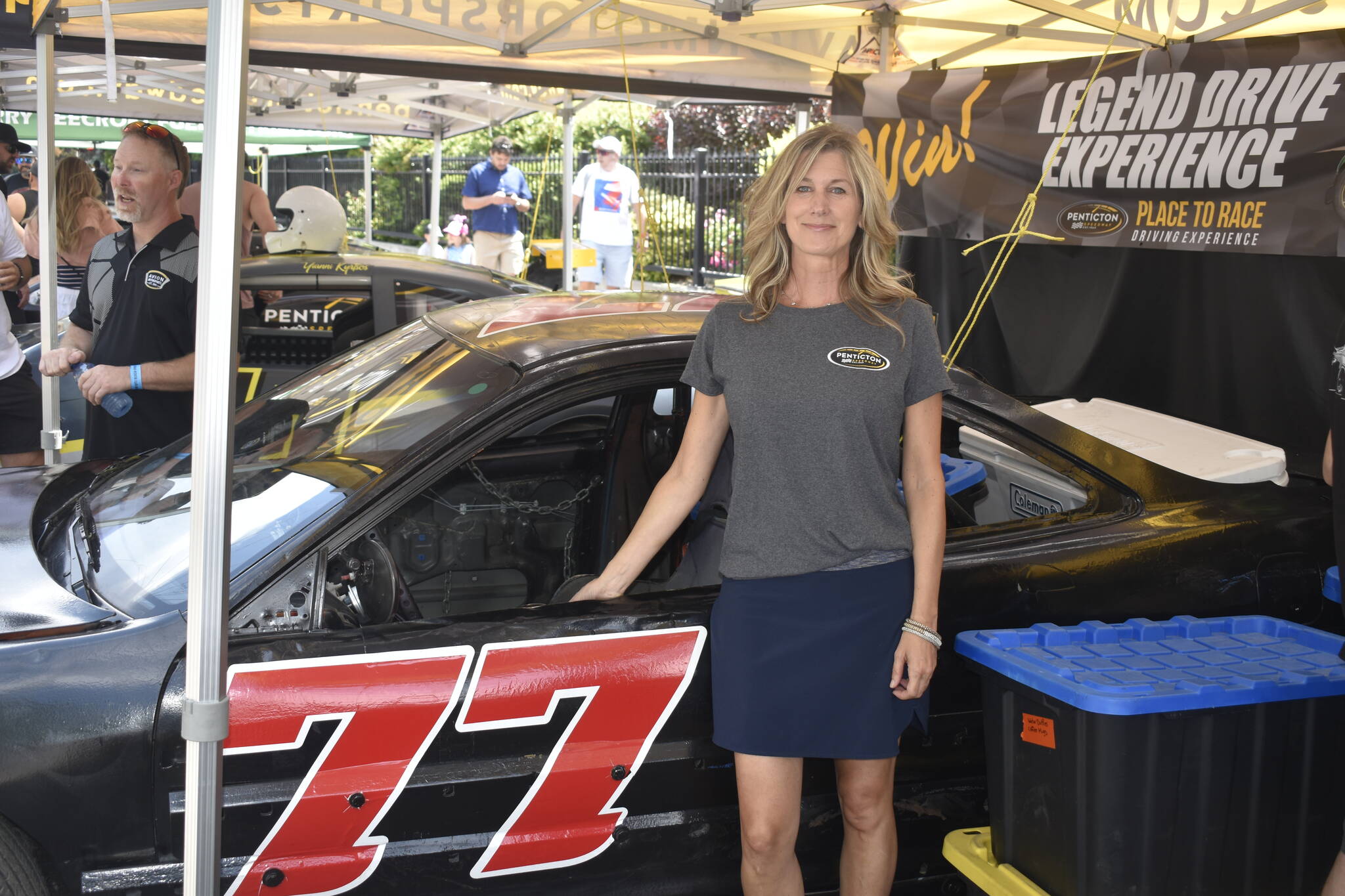 The Penticton Western News Tracey Anderson next to her No. 77 Hornet after making her debut on the race track at the Penticton Speedway one week prior. (Logan Lockhart/Black Press)