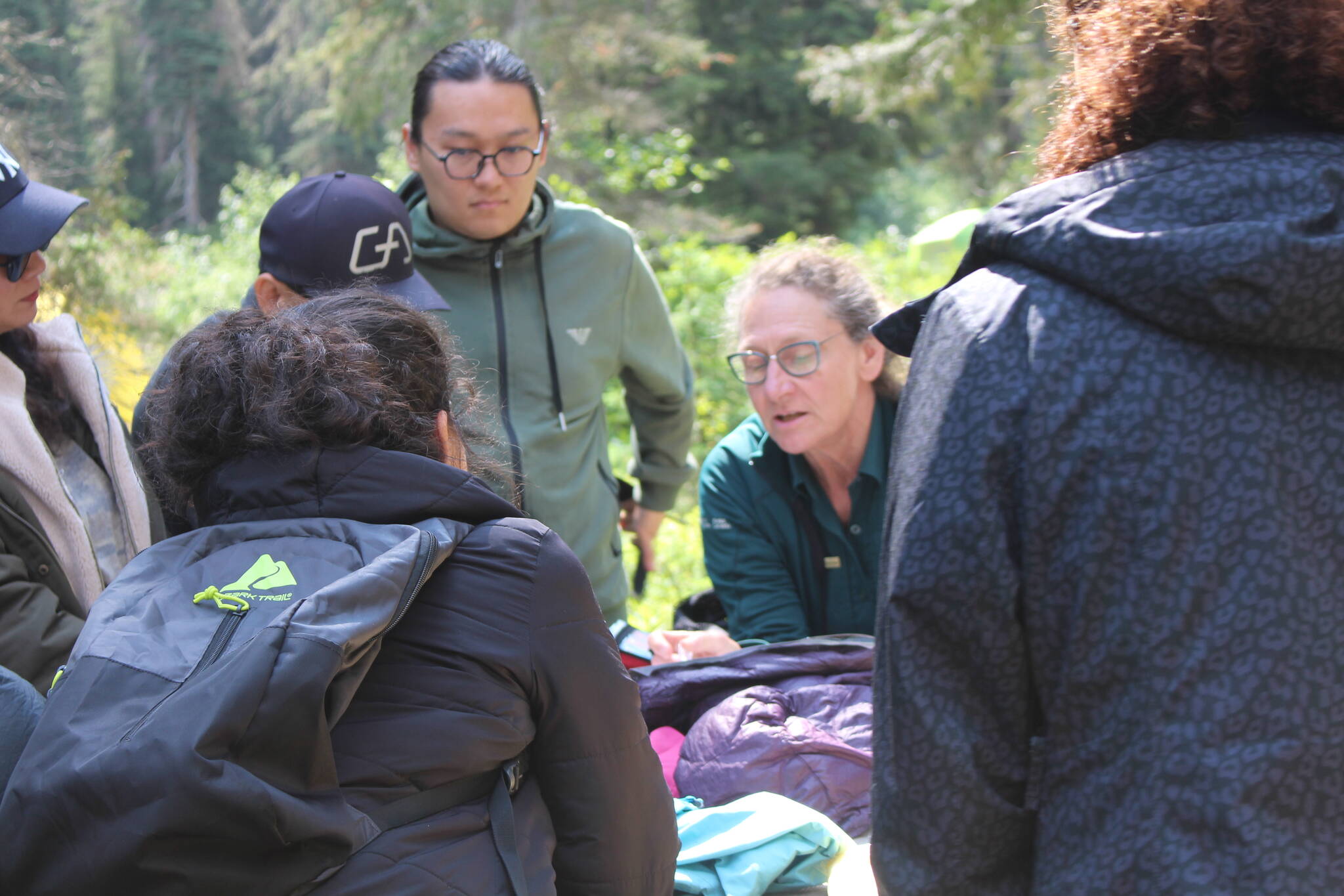 The group learns how to pack their backpacks. (Zachary Delaney/Revelstoke Review)