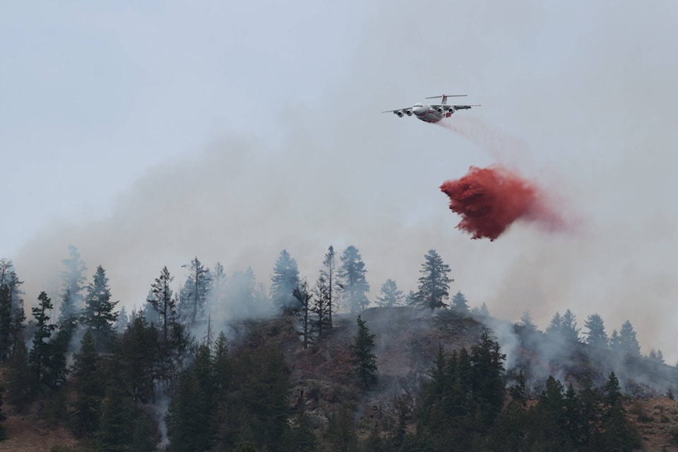 Retardant being dropped on a wildfire burning in Spallumcheen Friday, July 7, 2023. (Brendan Shykora - Morning Star)
