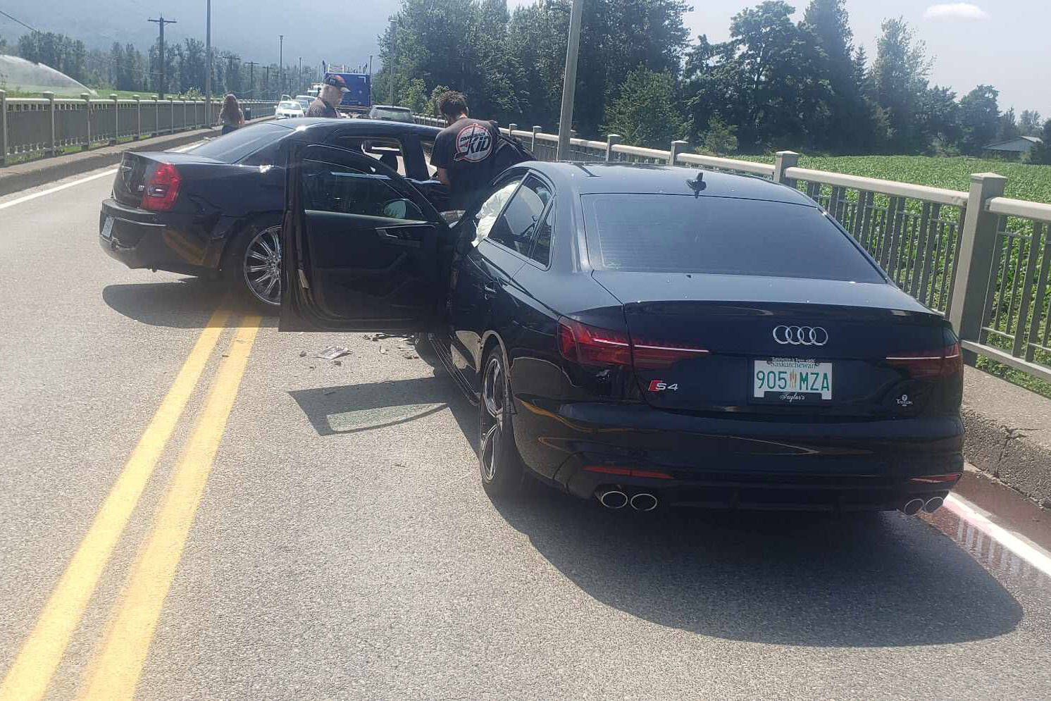 This Audi (foreground) was the third vehicle hit by a Chrysler 300 (left) in a crash that closed the Agassiz-Rosedale Bridge on July 8, 2023. (Sukh Mattu)