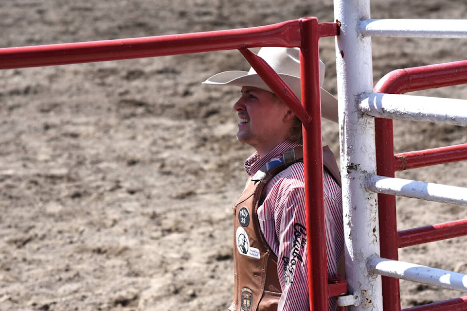 Armstrong cowboy Jaret Cooper, shown waiting for his result at the Williams Lake Stampede on the Canada Day long weekend, followed up a win in novice saddle bronc in the Laketown by finishing fourth at the legendary Calgary Stampede, where he was the defending event champion. (Angie Mindus - Black Press Media)