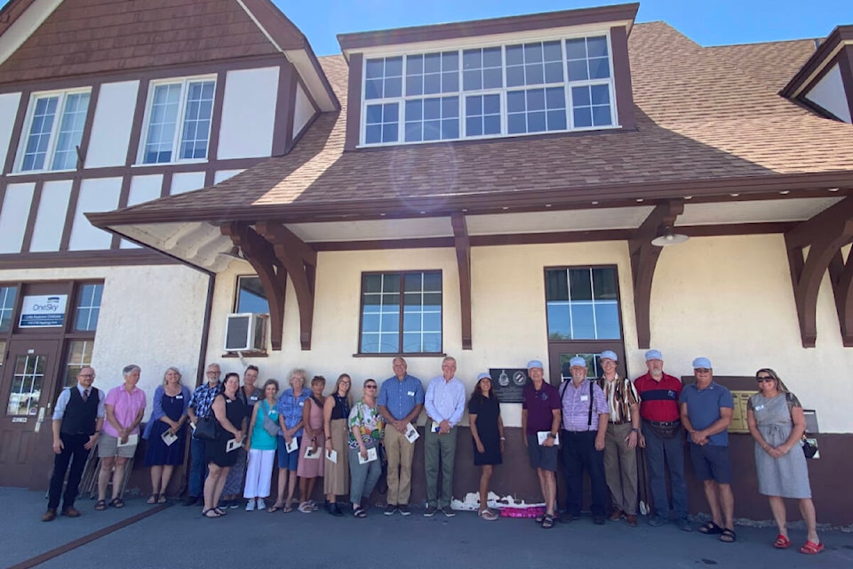 Staff at OneSky Community Resources and members of the Penticton Kinsmen Disability Resource Centre Society in front of the historic CPR railway station at 216 Hastings Avenue on Wednesday, July 19. (Logan Lockhart- Western News)