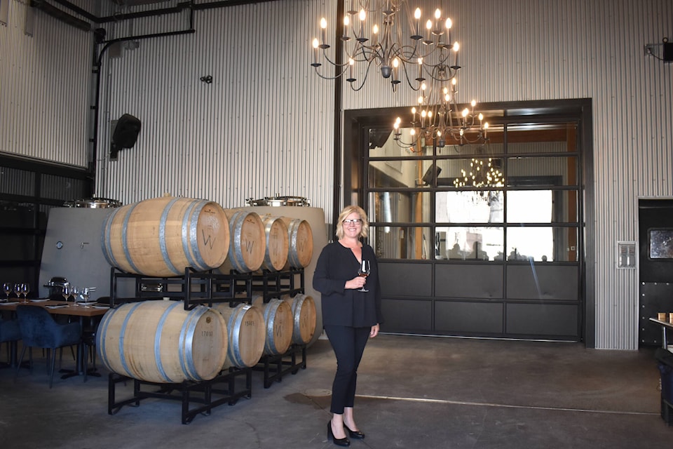 Time Family of Wines general manager Christa Lee McWatters stands in the barrel room (theatre No. 1 of the old Pen Mar theatre) at the grand opening of the new Chronos tasting room now open daily at 361 Martin Street in downtown Penticton. (Monique Tamminga Western News)