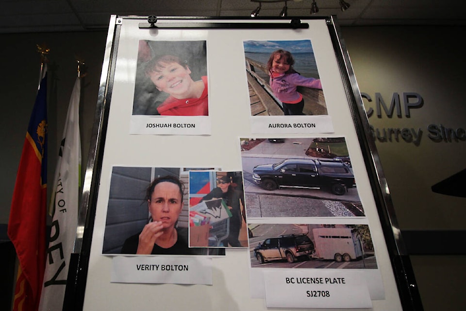 Surrey RCMP display a board of images of 10-year-old Joshuah Bolton, his sister eight-year-old Aurora, their mother Verity and the vehicle they’re believed to be in. Police provided updated surveillance images of the vehicle and Verity being spotted leaving a grocery story in Kamloops on July 15. (Lauren Collins)