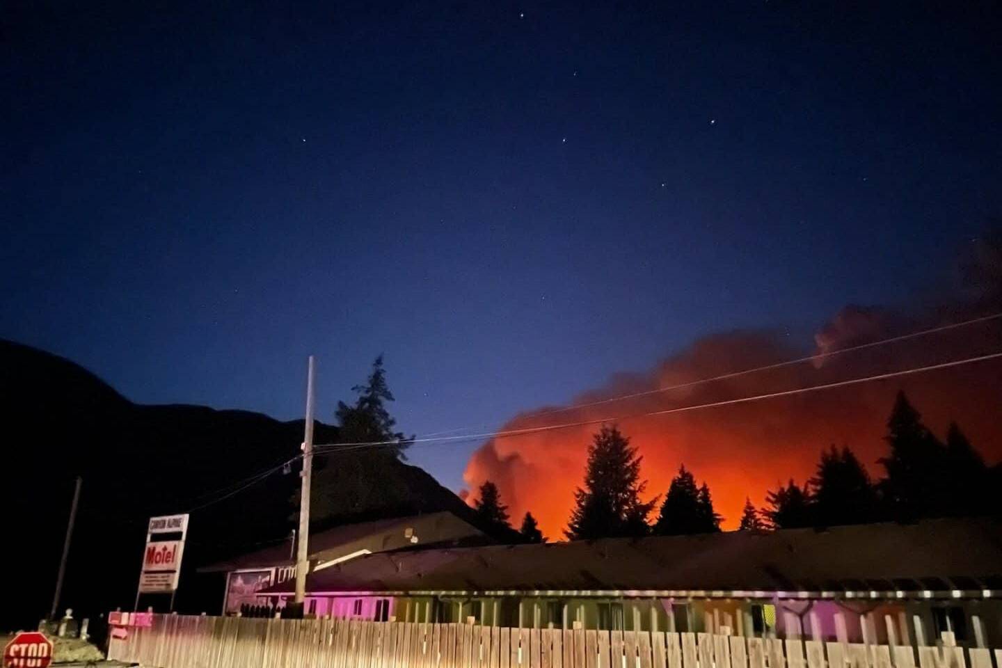 The Kookipi Creek wildfire as seen from Canyon Alpine Motel north of Boston Bar in the Fraser Canyon on the evening of Aug. 17. The fire has prompted evacuation orders for properties in the Fraser Valley and Thompson-Nicola Regional Districts, and an evacuation alert for the Village of Lytton. (Photo credit: Debbie Harper/Facebook)