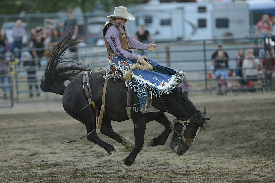 Armstrong’s Jaret Cooper competes in the saddle bronc event at the Chilliwack Rodeo during the 151st annual Chilliwack Fair on Friday, Aug. 11, 2023. Cooper won the B.C. championship in the event in 2023, and is looking to advance to a second consecutive Canadian Finals Rodeo Nov. 1-5 in Red Deer. (Jenna Hauck/ Black Press)
