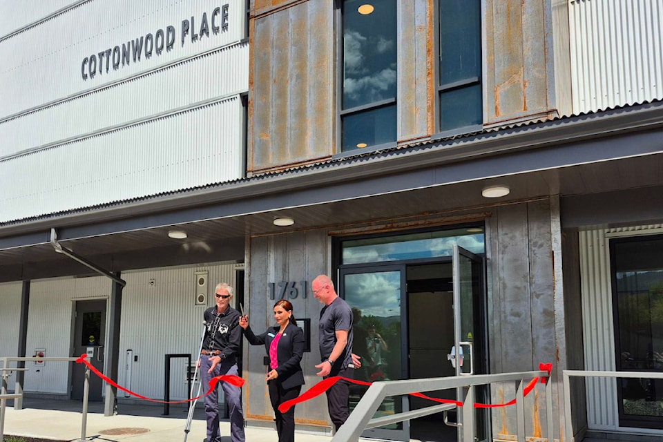Lumby and District Senior Citizens Housing Society chair Joe Deuling (from left), Vernon-Lumby MLA Harwinder Sandhu, and Mayor Kevin Acton cut the ribbon to officially open Cottonwood Place, Friday, May 23. The facility is home to 20 rental units for seniors and low-income residents.