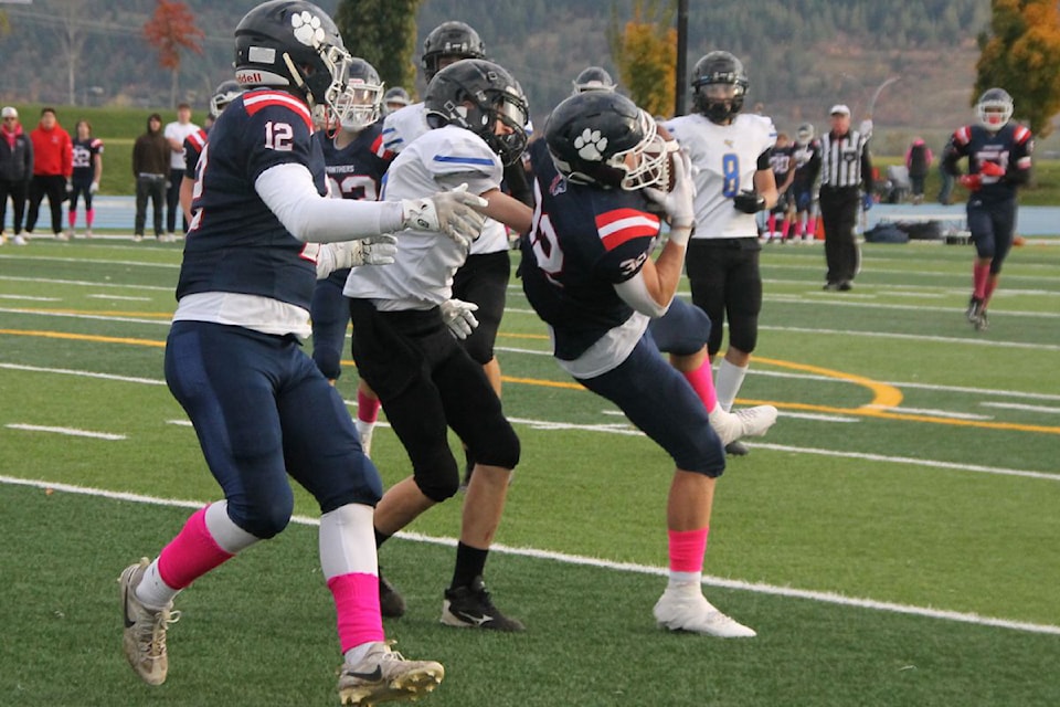 Vernon Panthers receiver Owen West (32) hauls in a catch in front of Seaton/Kalamalka Sonics defender Cody Kiel during the Panthers' 54-0 win in the Battle of Vernon Interior AA/AAA Junior Varsity Football League game Wednesday, Oct. 23, at Greater Vernon Athletic Park.