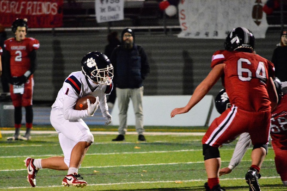 Keltyn McAreavy of the Vernon Panthers (with ball) had a career night in the Cats' 56-0 B.C. Senior Varsity AA Football League provincial quarterfinal wipe out of Okanagan Conference rivals South Kamloops Titans Friday, Nov. 15, at Greater Vernon Athletic Park.  McAreavy rushed for 119 yards on nine carries, and scored a 25-yard touchdown run for VSS.