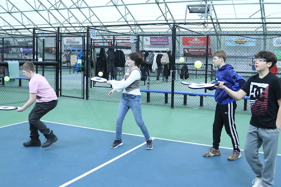 Vernon Grade 7 students Hunter Malic (from left), Yasmin Armstrong, David Vosborn, and Hunter Laurin-Simpson keep their eyes on the balls during an introduction to pickleball program, hosted by the Vernon Pickleball Association.